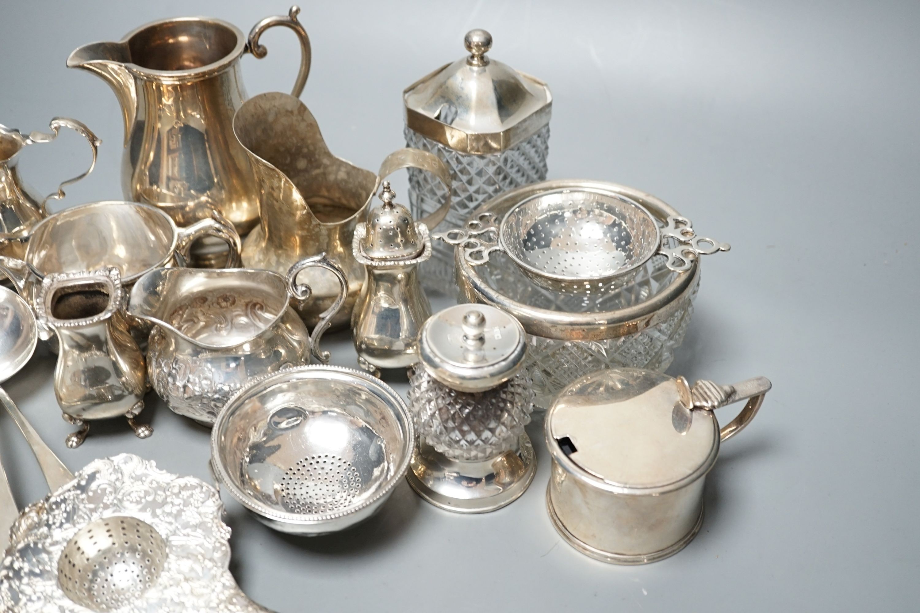 A mixed collection of small silver and sterling items, to include five assorted small ladles, cream jugs, Georgian mustard, bowls etc.